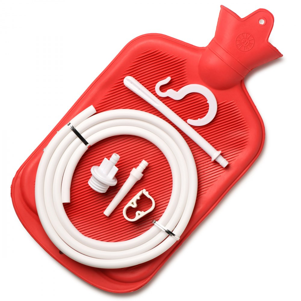 Red hot water bottle with white hose and connectors on a white background