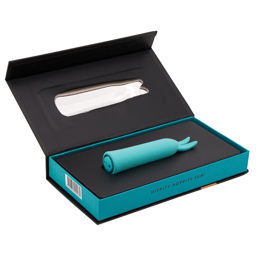 Turquoise silicone product in an open black and teal box on a white background