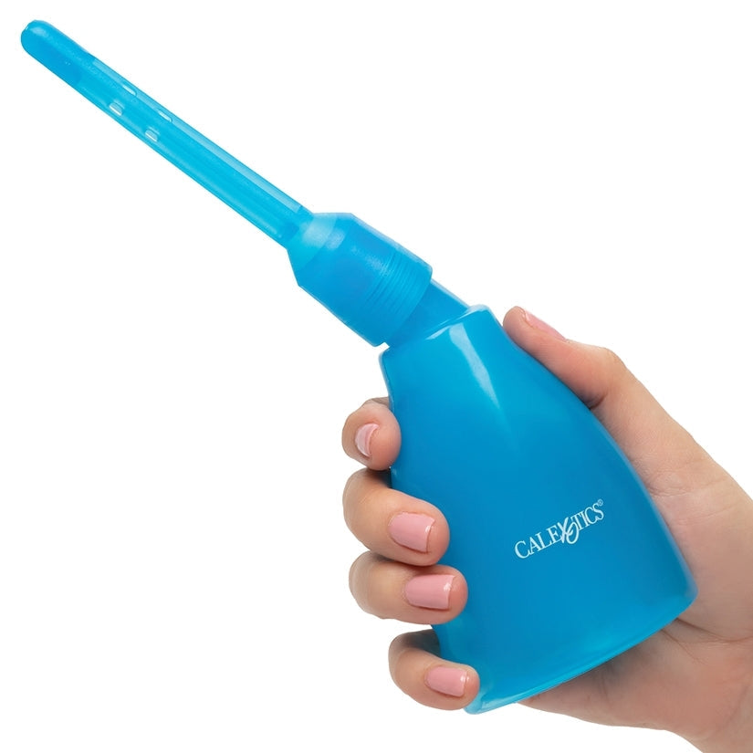 Blue plastic tool held in a hand on a white background